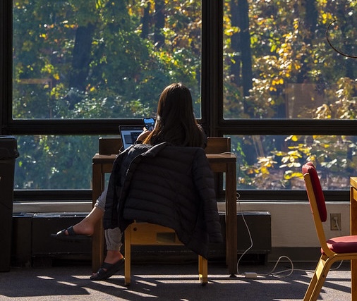 image of a student sitting at a desk